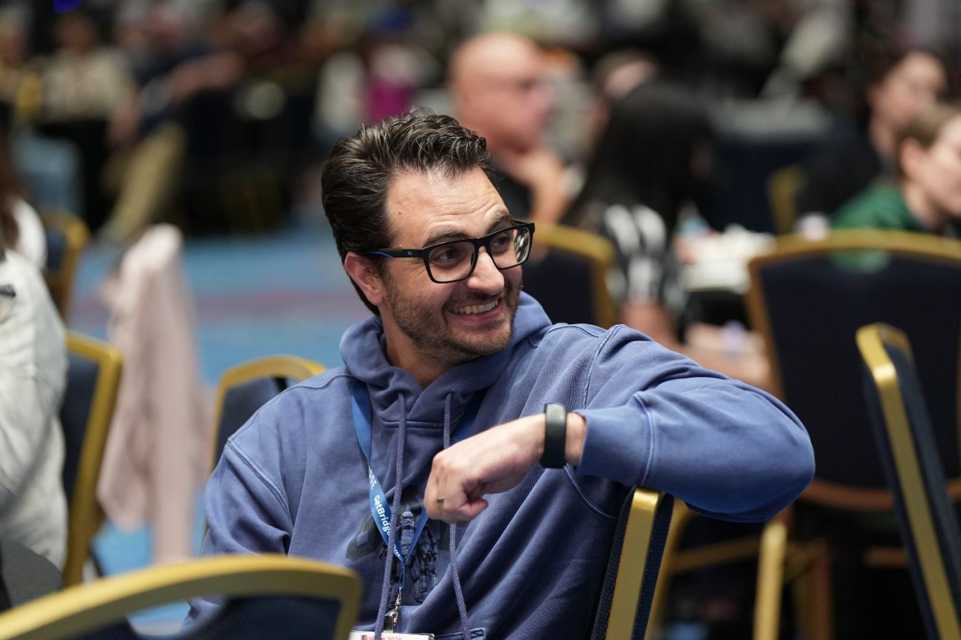 Bernardo at a conference, mid-laugh